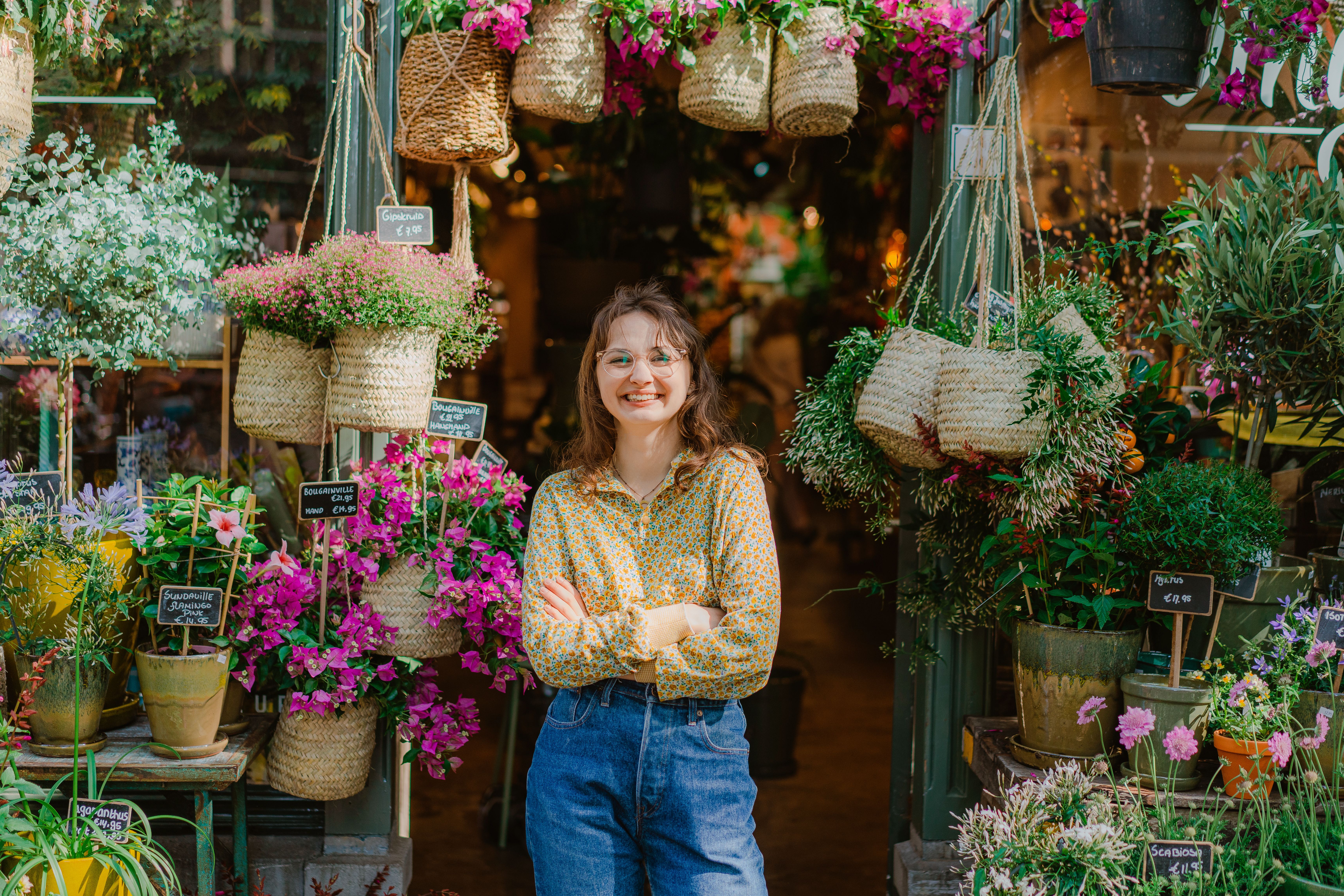 Florist at the entrance of her flower shop