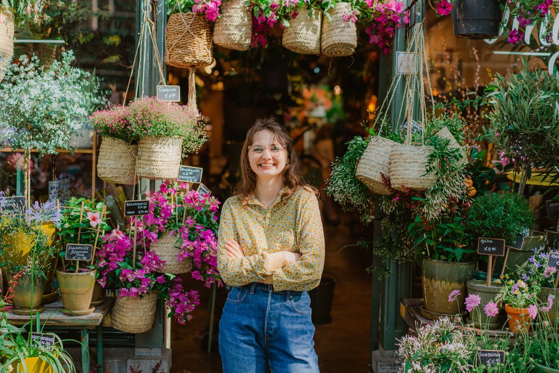Florist at the entrance of her flower shop